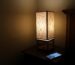 Small tripod bedside lamp with linen shade