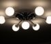 Star projector casting light across a bedroom ceiling