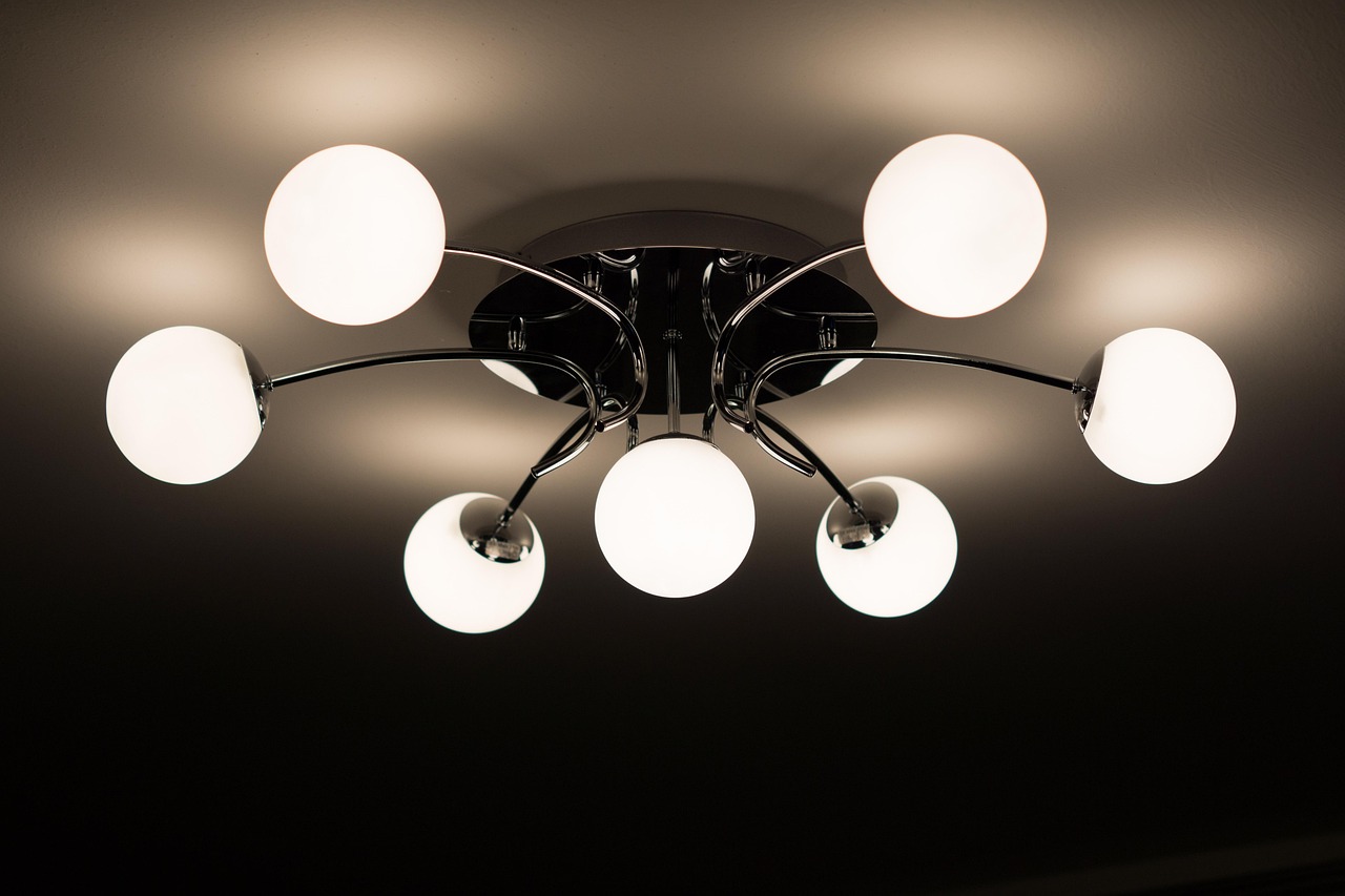 Star projector casting light across a bedroom ceiling